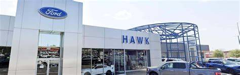 A diverse range of Ford vehicles available at Hawk Ford IL, including trucks, SUVs, and cars, showcasing their modern designs and capabilities.