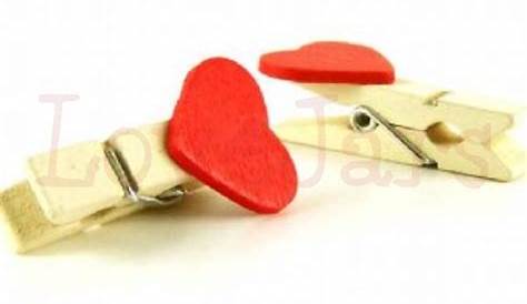 Fastening the Heartcushion with a Clothes Pegs Stock Photo Image of