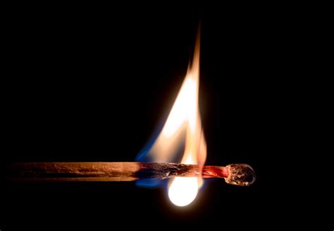 A match head in flames. Rights Managed Image by