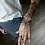 henna tattoo on arm and hand