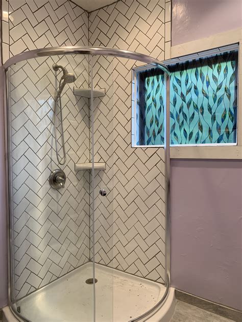 The Bold Look of Kohler Herringbone tile, White subway tile shower, Bathroom design