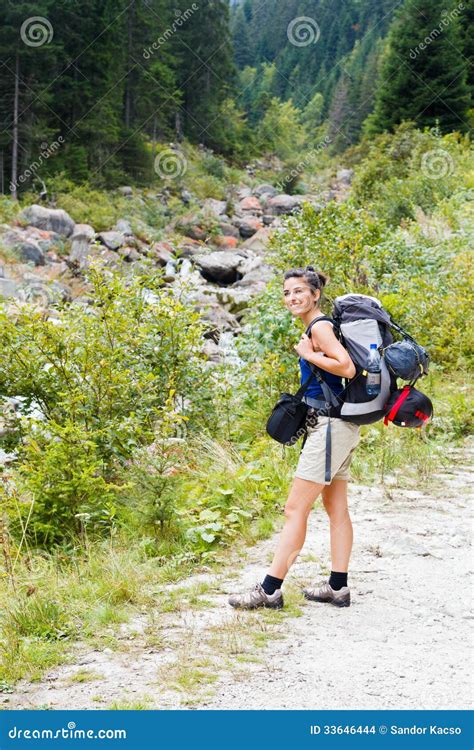 Woman with a Backpack Hiking Stock Photo PixelTote