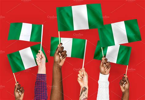 holding nigeria flag