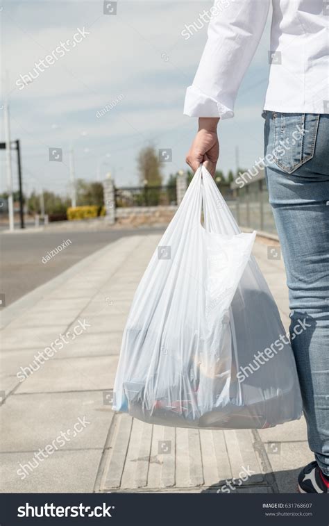 Holding Plastic Bag