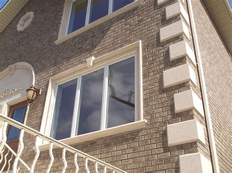 Home with precast concrete window surrounds, quoins and sills