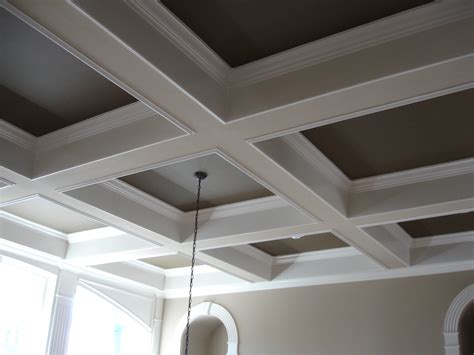 The classic coffered ceiling adds a cozy touch to this sitting area