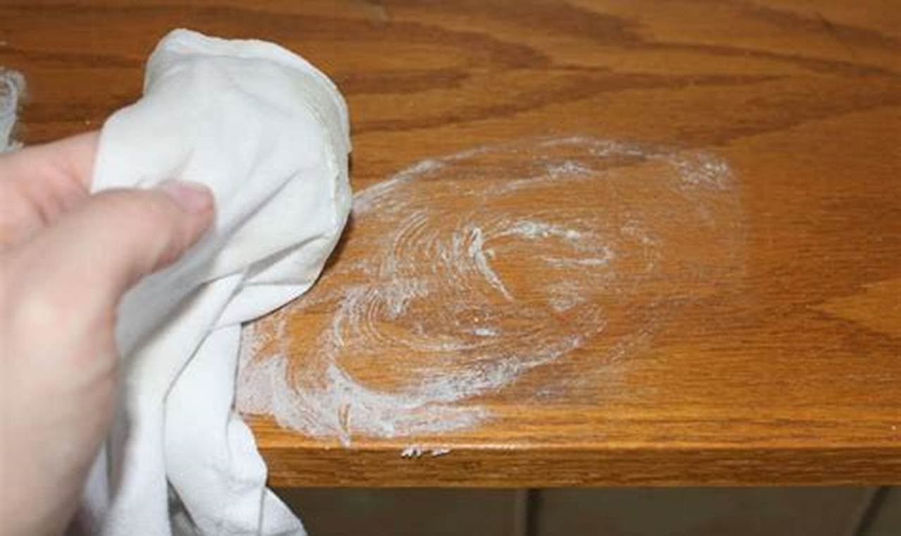how to get water stains out of teak furniture