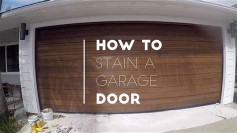 Gel stain applied to metal garage door to look like wood. It took three