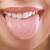 how to stop pressing tongue against teeth
