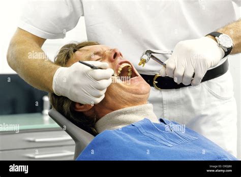 Dentist pulling teeth stock image. Image of cleaning 38628489