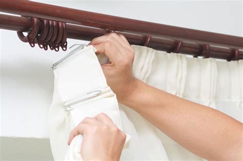 how do you hang pinch pleat curtains