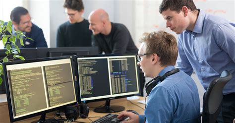 how does a software developer differ from a computer programmer