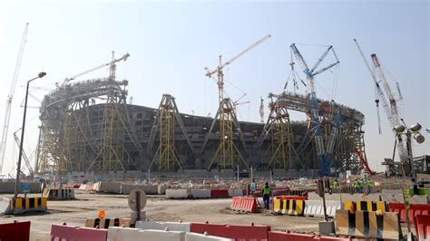 how many people died building qatar stadiums