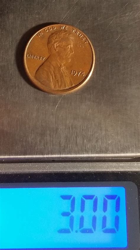 how much does a penny weigh in grams