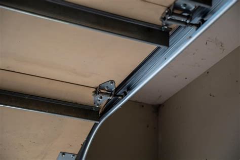 how much does it cost to replace garage door rollers