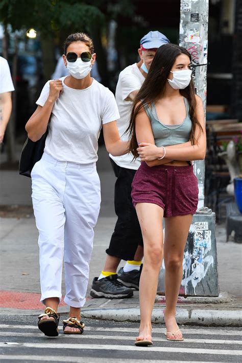 Suri Cruise, 14, looks nearly as tall as mom Katie Holmes … as the pair