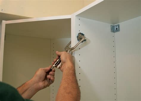 How To Attach Cupboard To Wall