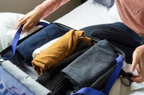 how to fold clothes for a suitcase