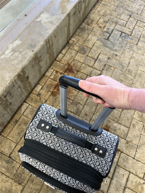 How To Get Suitcase Handle Down