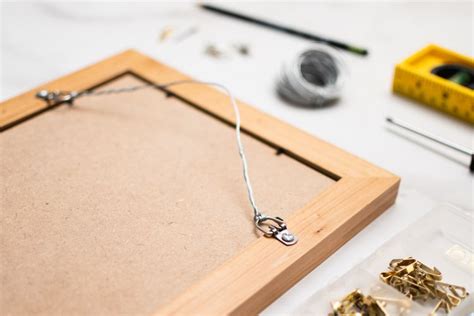 How To Hang A Frame Using Wire