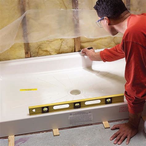 how to install a shower base on a wood floor