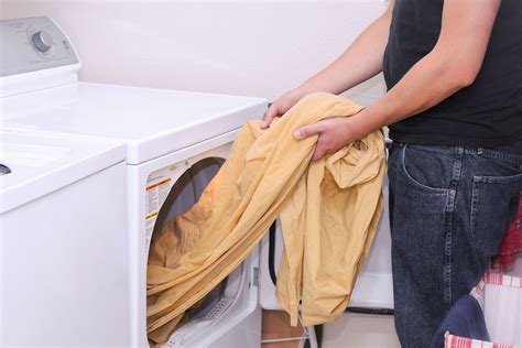 how to keep fitted sheets from balling up in dryer