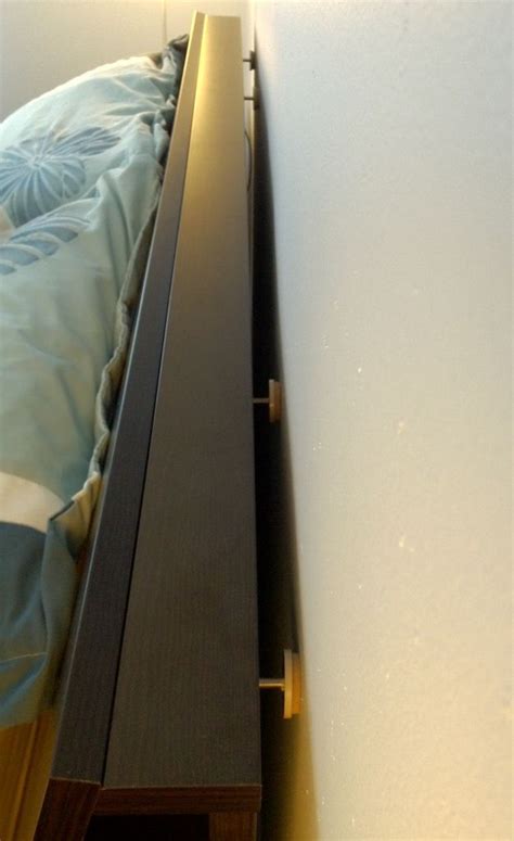 How To Keep Your Headboard From Hitting The Wall