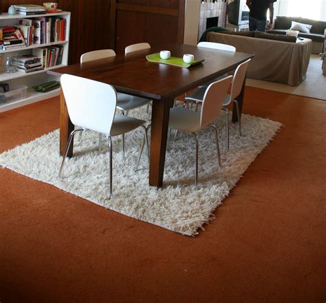 How To Layer Rugs Under A Dining Table