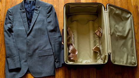 how to put a suit in a suitcase