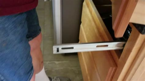 how to release cabinet drawer slides