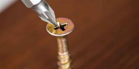 how to remove a stuck screw from the wall