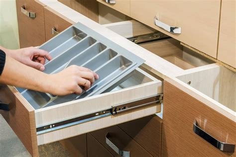 how to remove cabinet drawers with bottom slides