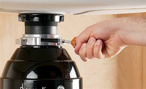 How To Remove Garbage Disposal Mounting Bracket