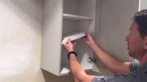 how to remove shelf from cabinet