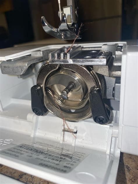 How To Remove Thread Stuck In Bobbin Case