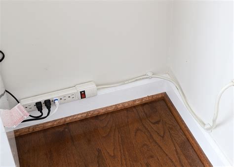 How To Stick An Extension Cord To The Wall