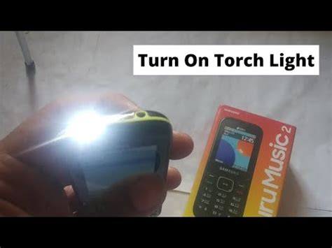 how to turn on torch while using camera
