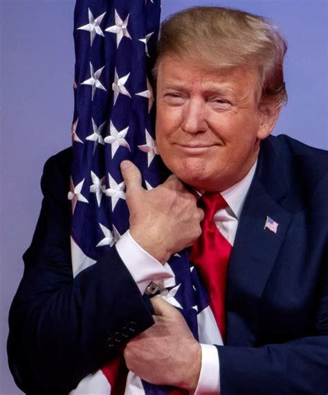 image of president trump hugging the flag