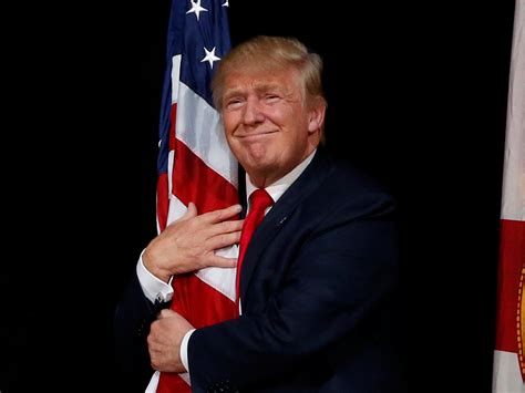image of trump hugging american flag