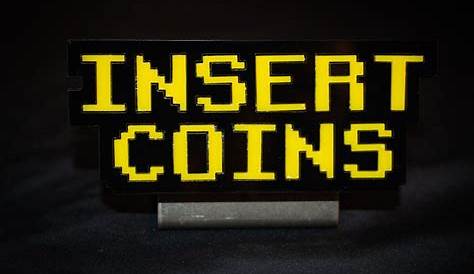 Insert Coin On Arcade Machine Stock Photo Download Image