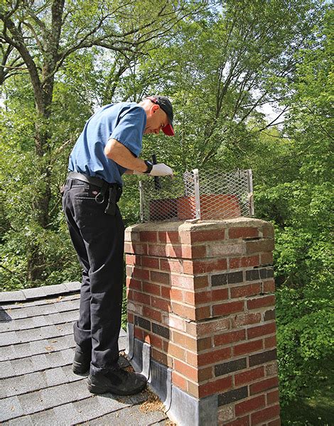 inspecting chimney for damage