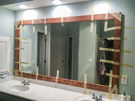 install wood frame around bathroom mirror