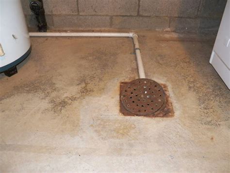 installing basement drain plate in concrete floor