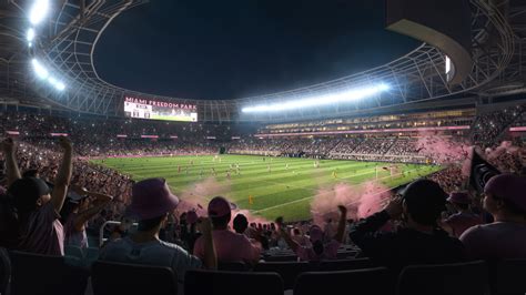 Inter Miami CF fans cheering and waving flags during a match at DRV PNK Stadium.