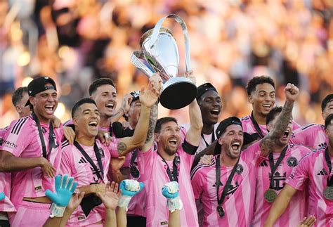 Inter Miami CF players lifting the MLS Cup trophy
