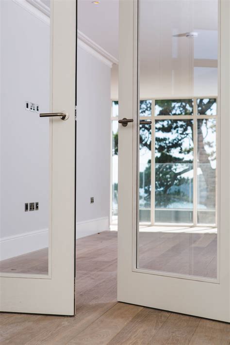 Contemporary white washed Ash veneer Trinity style double doors with