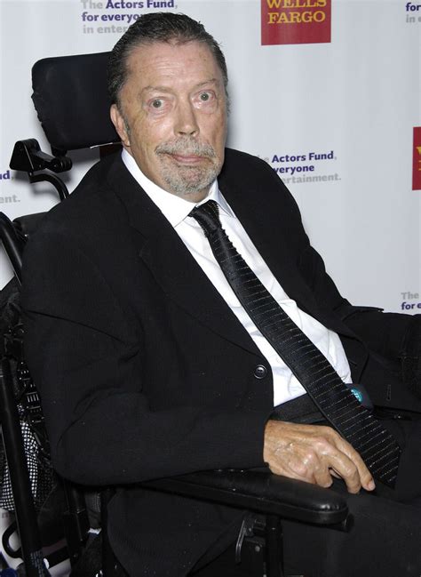 is tim curry in a wheelchair