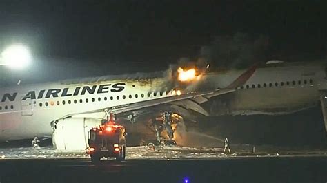 japan airlines plane fire airport