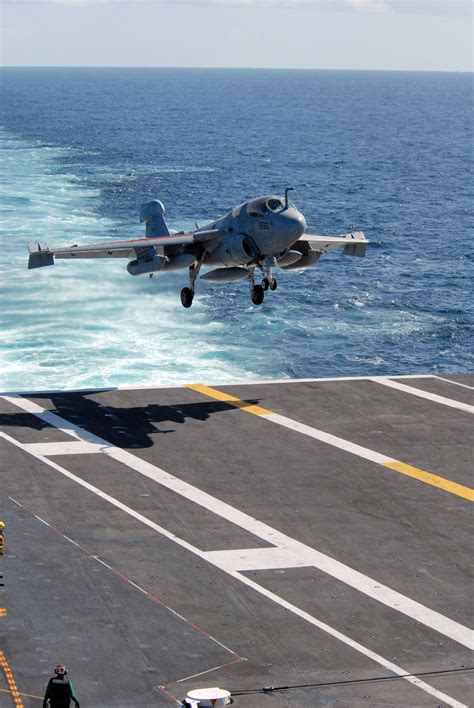 jet landing on aircraft carrier