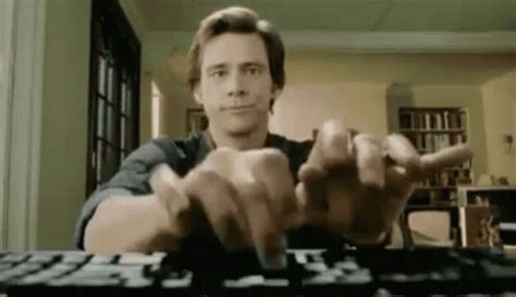 jim carrey typing fast gif